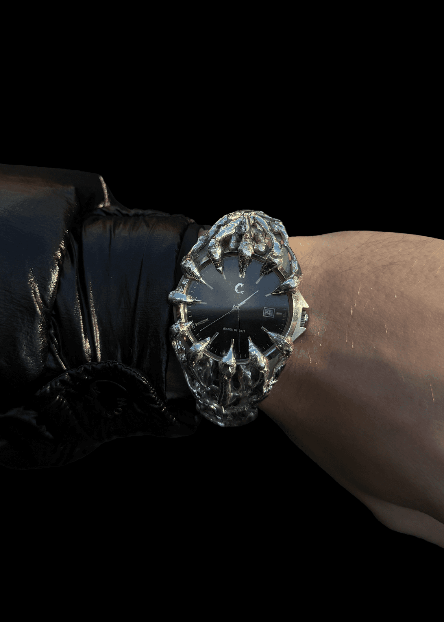 ABYSS Chrome Watch worn on wrist, highlighting its unique skeletal chrome casing and black dial with date display and Japan Quartz precision.