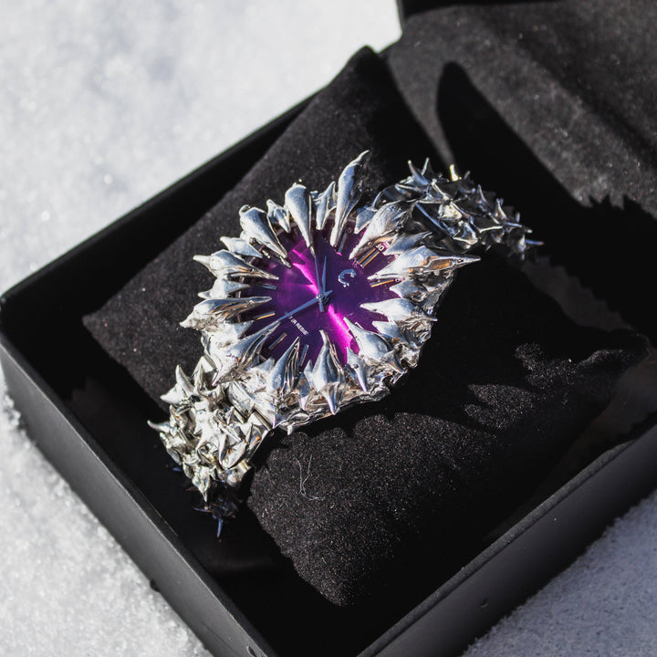 AMETHYST THORN watch in black display box, featuring a radiant purple face and aggressive silver spike detailing on the band.
