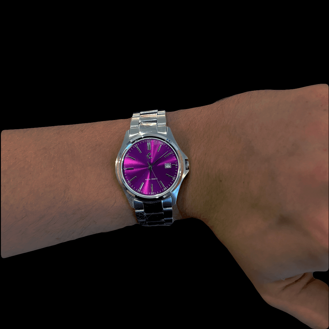 Close-up of AMETHYST watch worn on wrist, highlighting the bold purple dial and polished stainless steel bracelet.