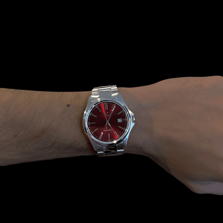RUBY red dial stainless steel watch worn on wrist, displaying bold color and sleek, modern style for everyday wear.