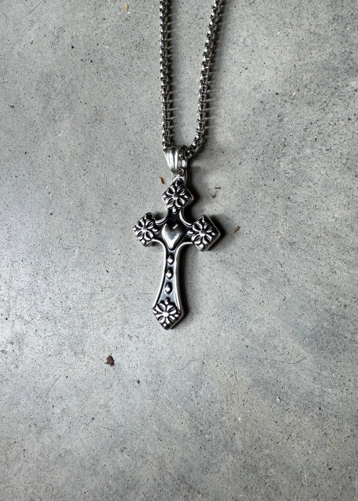 Bloom Cross Necklace with floral engravings on stainless steel, featuring a polished finish and hypoallergenic durability.