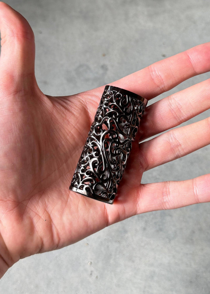 Baroque Midnight - Baroque Lighter Case shown in hand for scale, featuring elegant scrollwork and durable craftsmanship.