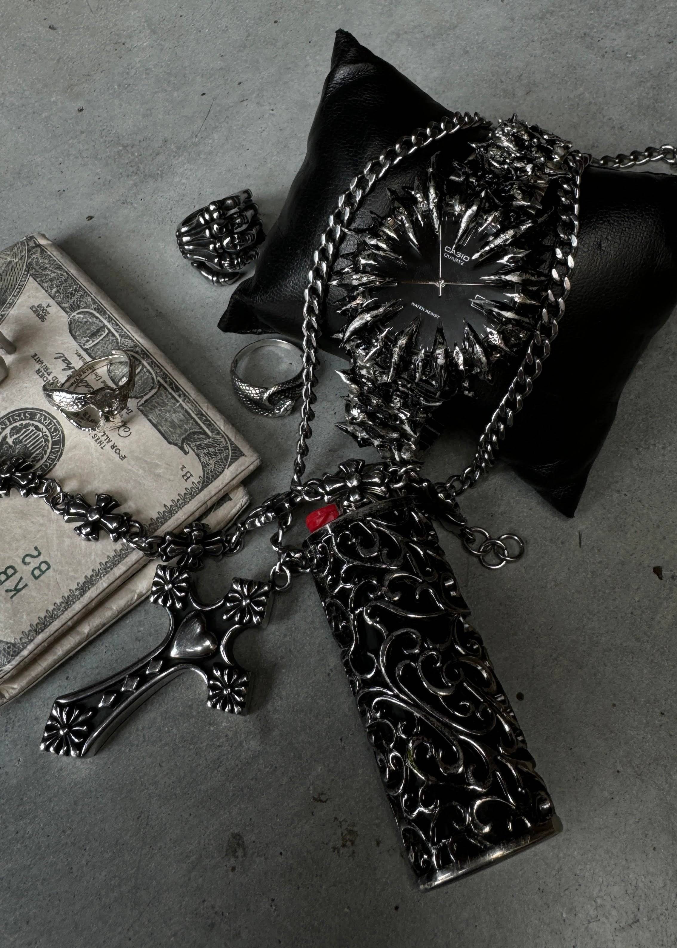 Floral Stainless Steel Bracelet styled with gothic jewelry including rings, cross pendant, and watch, emphasizing bold, durable accessories.